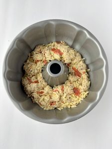 Raw pizza bread mixture in a Bundt pan